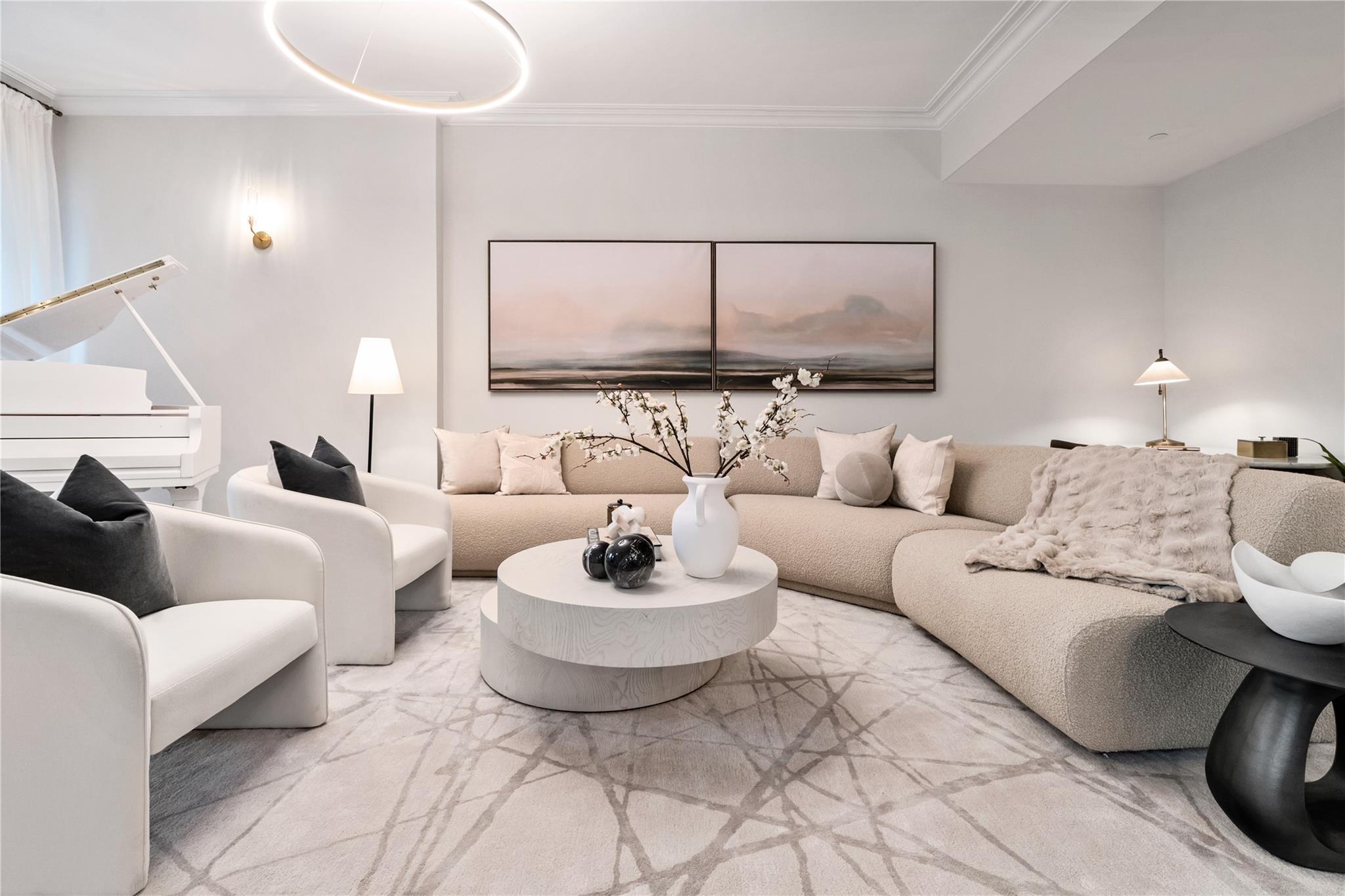 a living room with furniture and a lamp