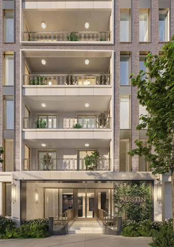 a front view of a building with glass windows and a table