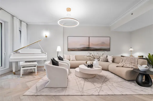 a living room with furniture and a painting