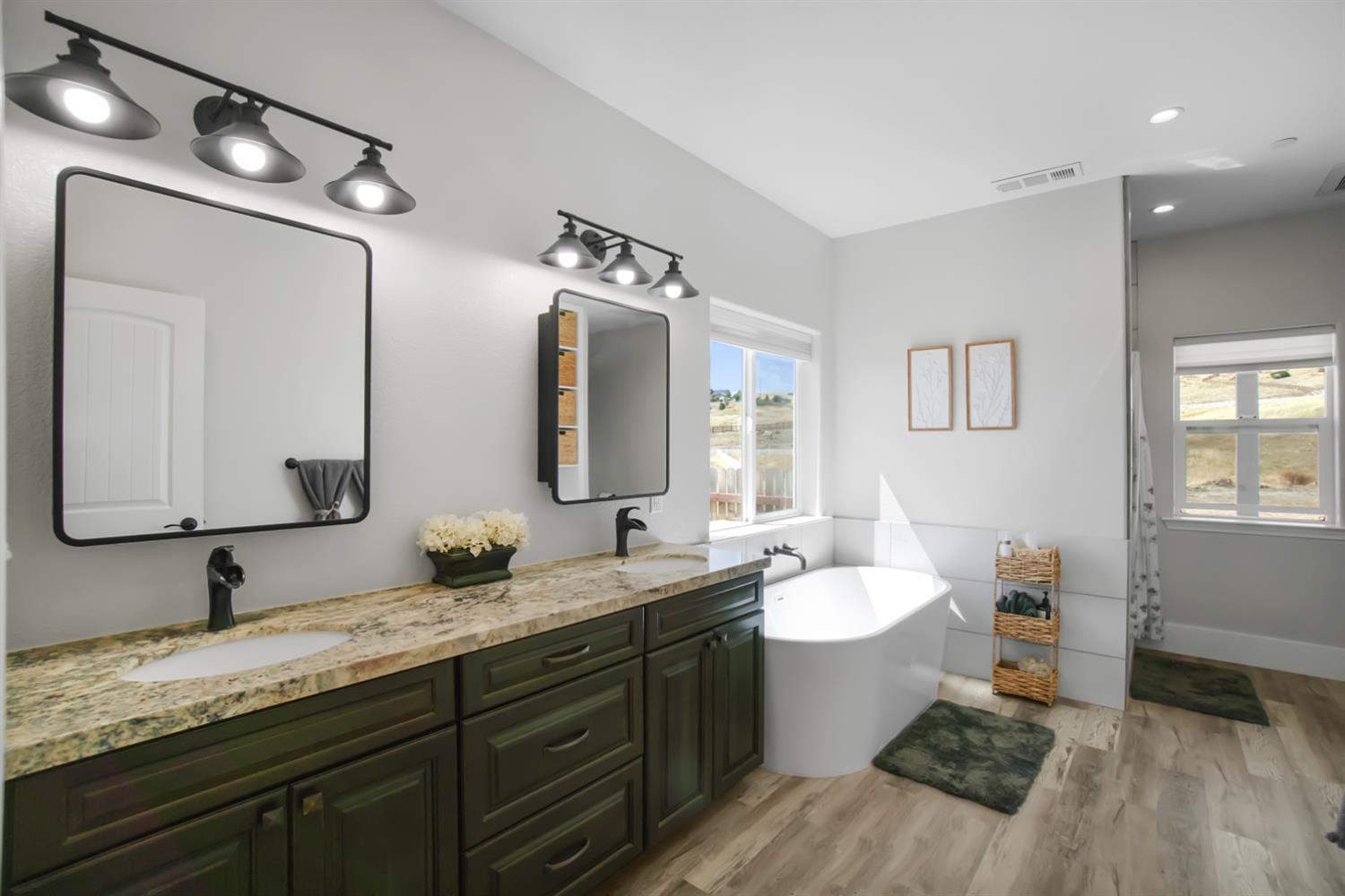 7991 South Shingle Road Shingle Springs, CA 95682 - Photo 23 of 58 a bathroom with a double vanity sink and a mirror