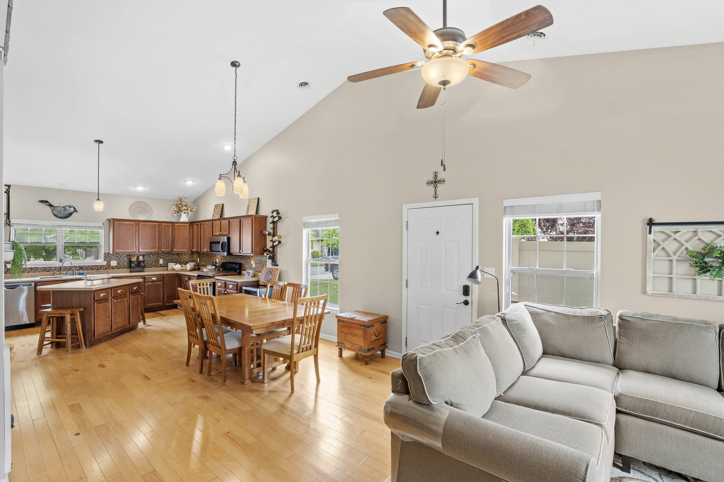 548 Aster Lane Griffith, IN 46319 - Photo 11 of 20 a living room with furniture kitchen view and a chandelier