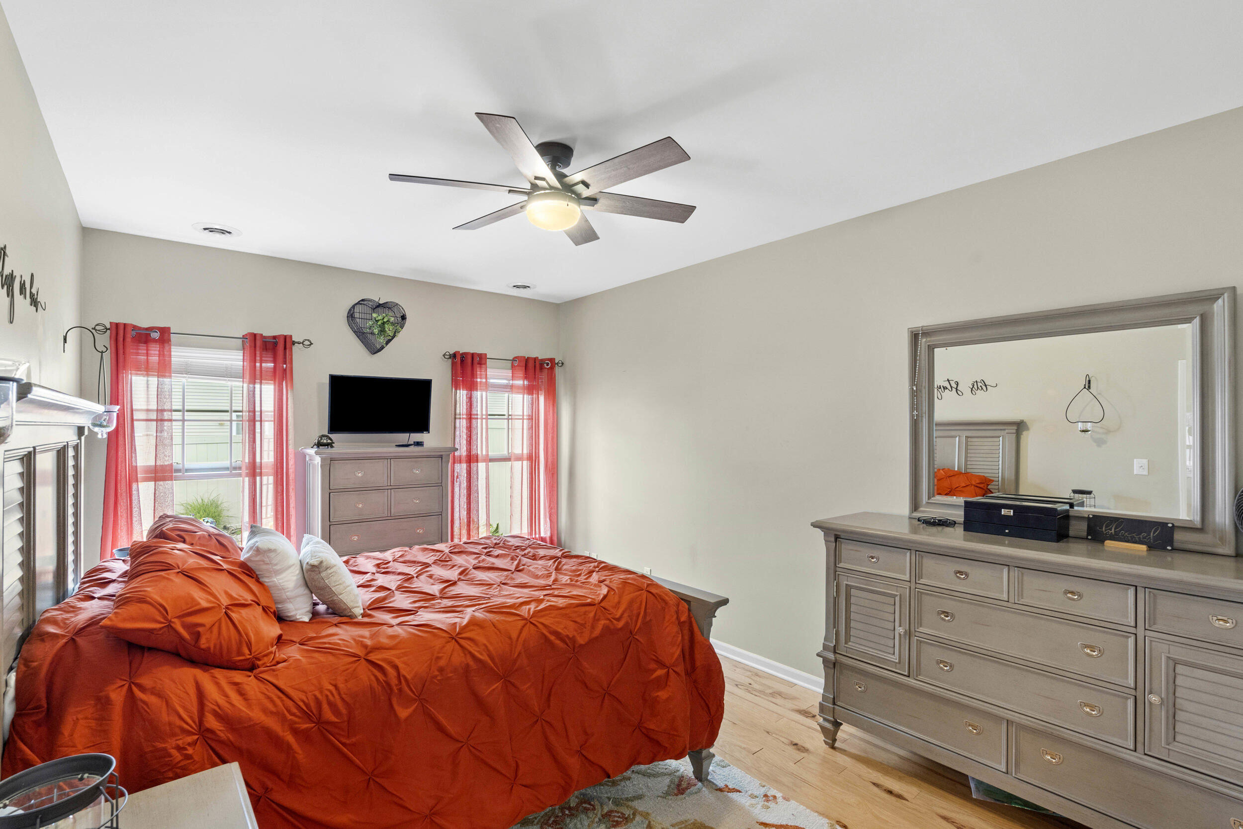 548 Aster Lane Griffith, IN 46319 - Photo 12 of 20 a bedroom with a bed and a flat screen tv