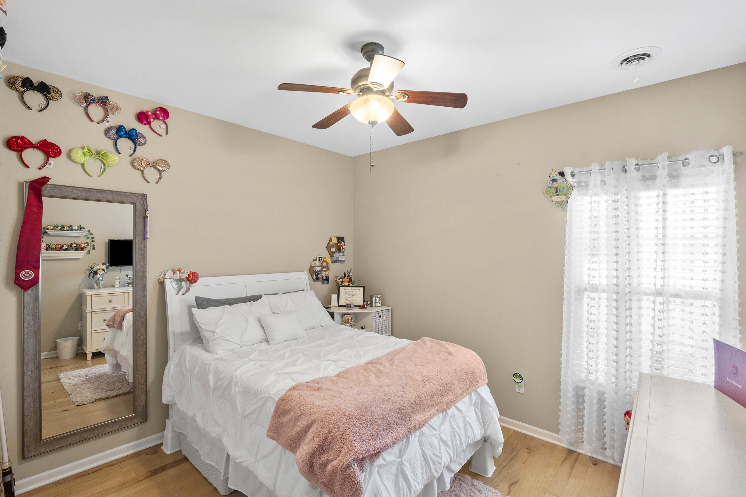 548 Aster Lane Griffith, IN 46319 - Photo 15 of 20 a bedroom with a bed and a chandelier