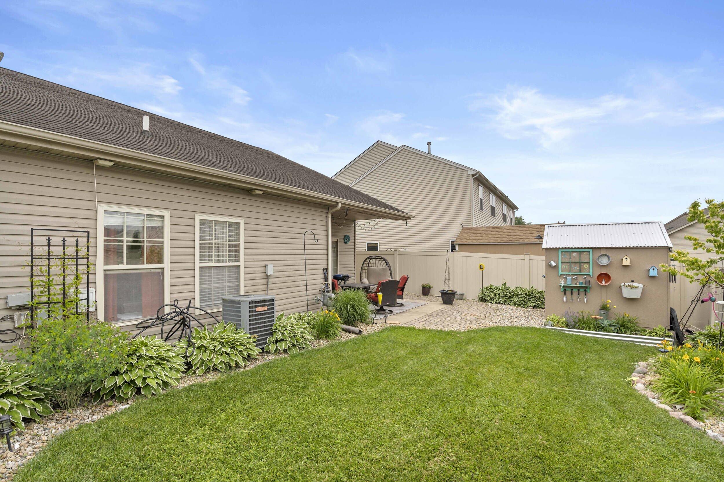 548 Aster Lane Griffith, IN 46319 - Photo 17 of 20 a house view with a garden space