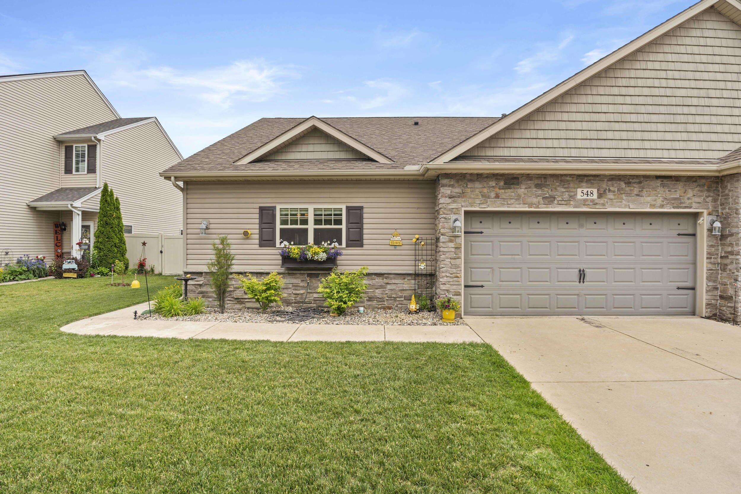 548 Aster Lane Griffith, IN 46319 - Photo 2 of 20 a front view of house with yard and seating space