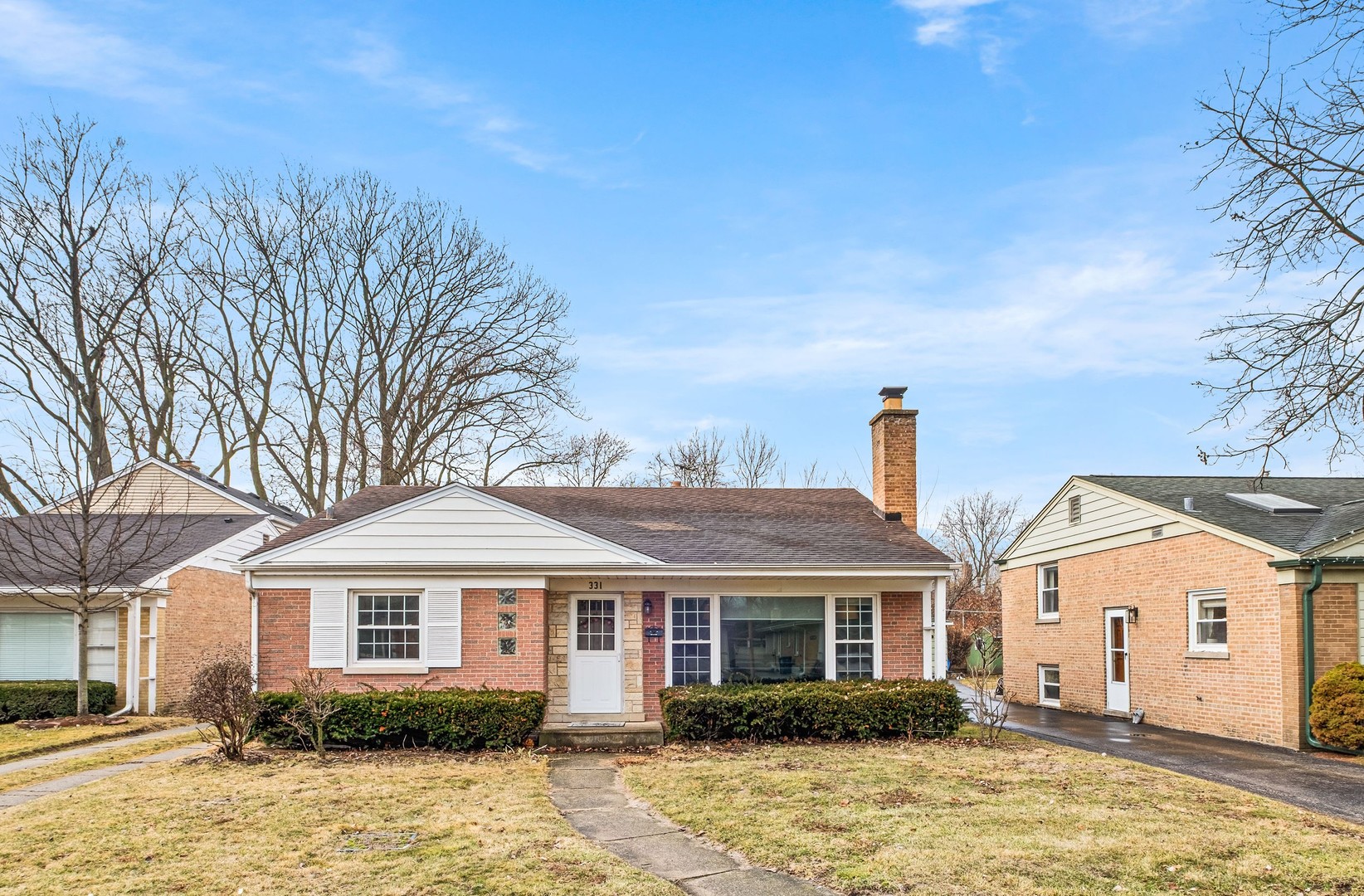 331 Romona Road Wilmette, IL 60091 - Photo 1 of 22 a front view of a house with a yard
