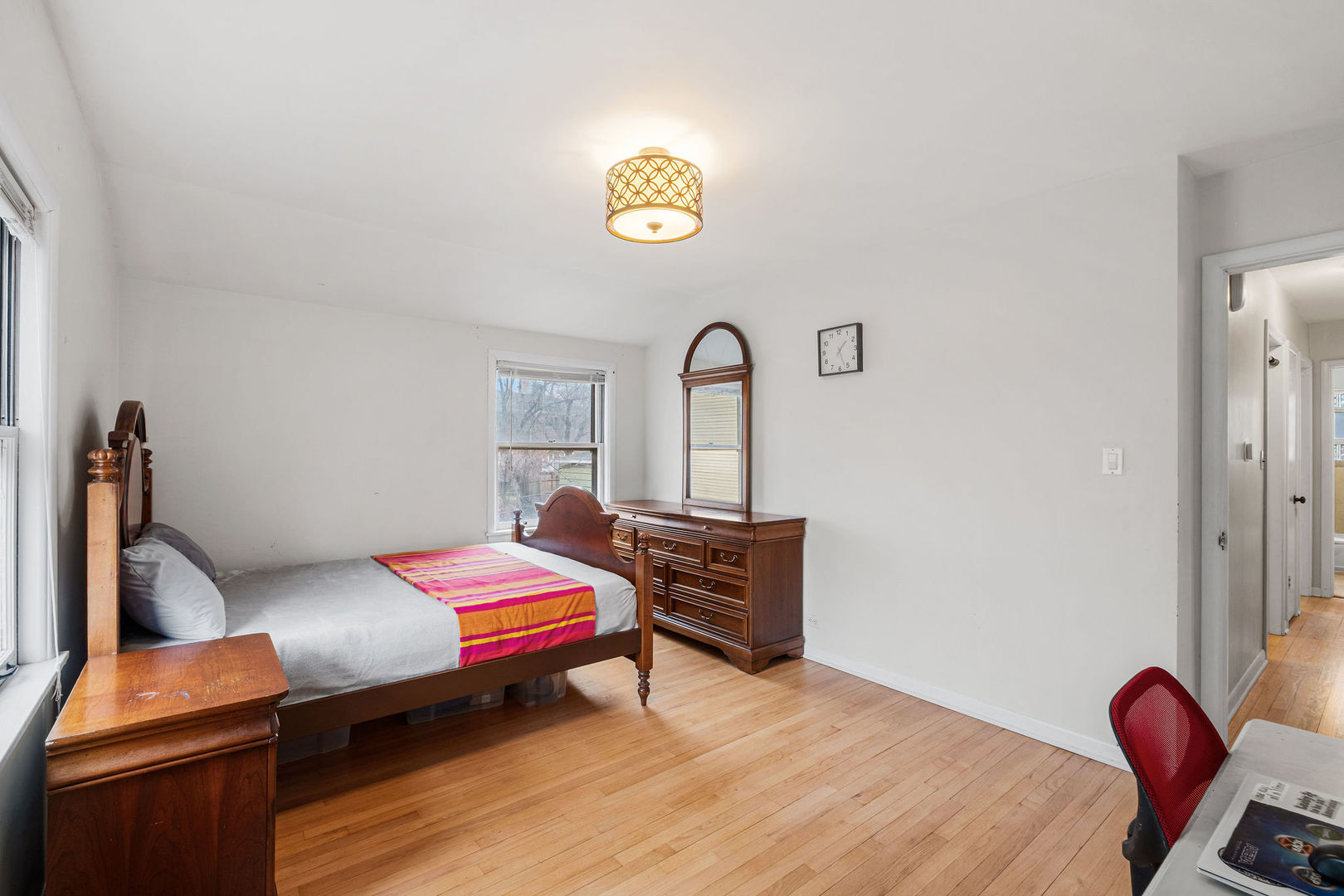 331 Romona Road Wilmette, IL 60091 - Photo 10 of 22 a bedroom with a bed and a table in it