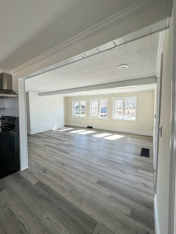 15 Wood Path Ashburnham, MA 01430 - Photo 3 of 12 a view of empty room with wooden floor and fan