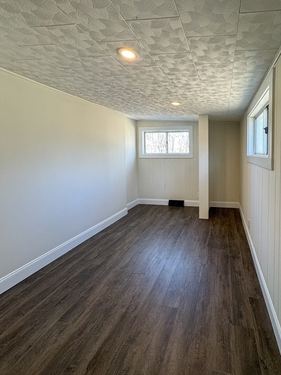 15 Wood Path Ashburnham, MA 01430 - Photo 7 of 12 an empty room with wooden floor and windows