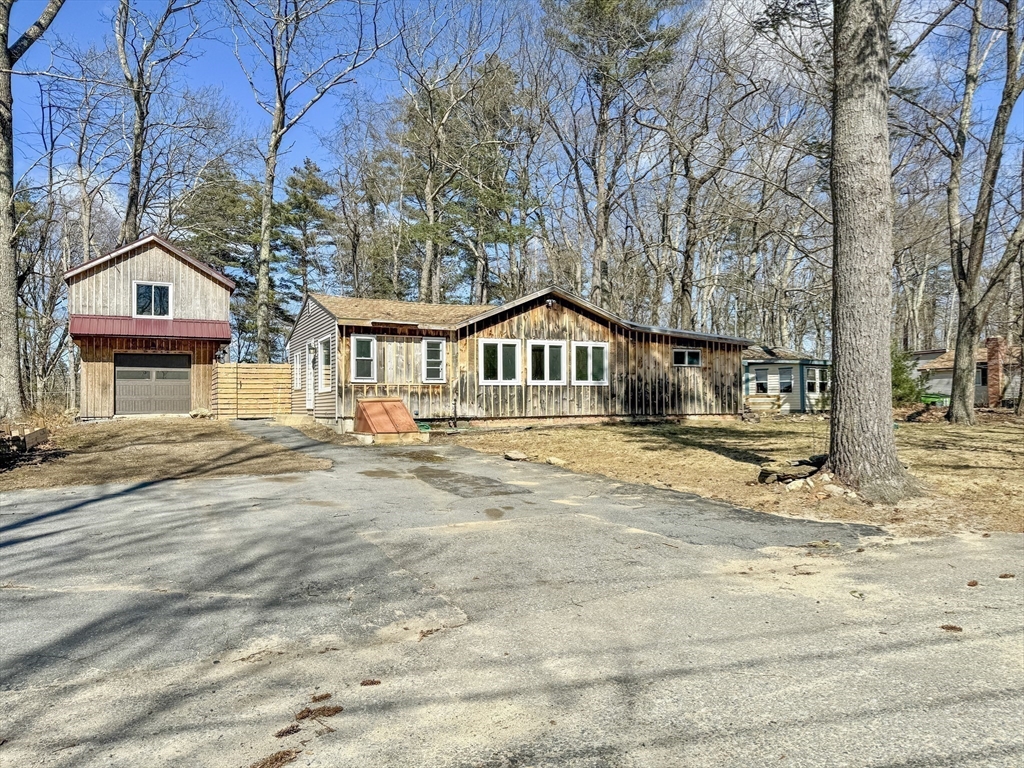 15 Wood Path Ashburnham, MA 01430 - Photo 9 of 12 a front view of a house with a yard