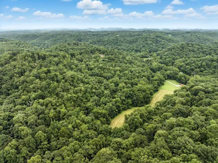 a view of a field with an outdoor space