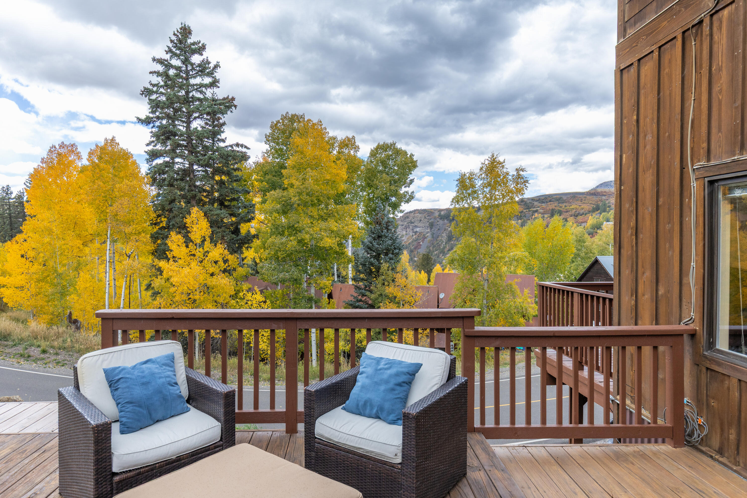 464 San Miguel Ridge, Unit 1 Telluride, CO 81435 - Photo 5 of 27 a view of a balcony with couches and wooden floor