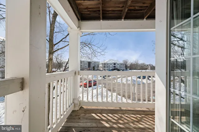 a view of a balcony with wooden fence