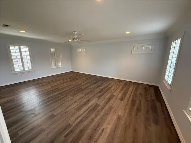 a large bathroom with a double vanity sink and a large mirror