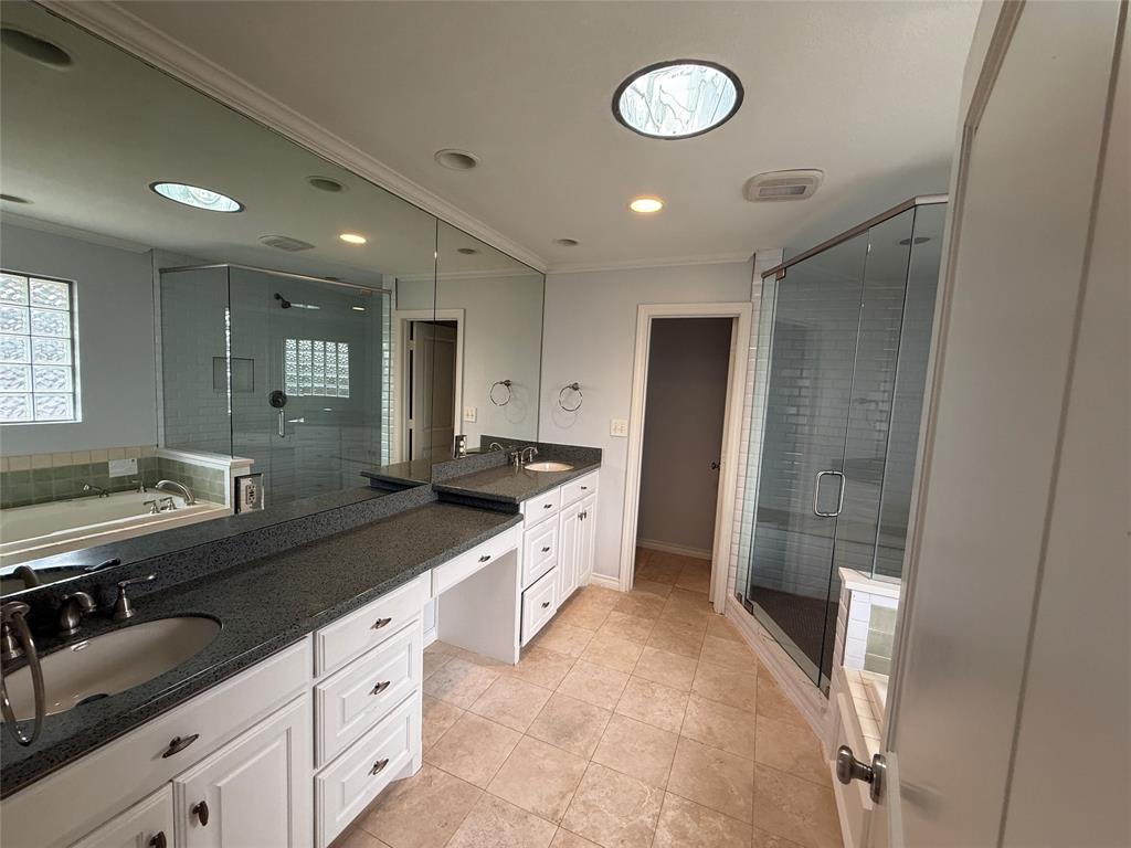 4916 Sugar Mill Road Dallas, TX 75244 - Photo 14 of 18 Upstairs Bathroom with a shower stall, double vanity, ornamental molding, light tile patterned floors, and a garden tub