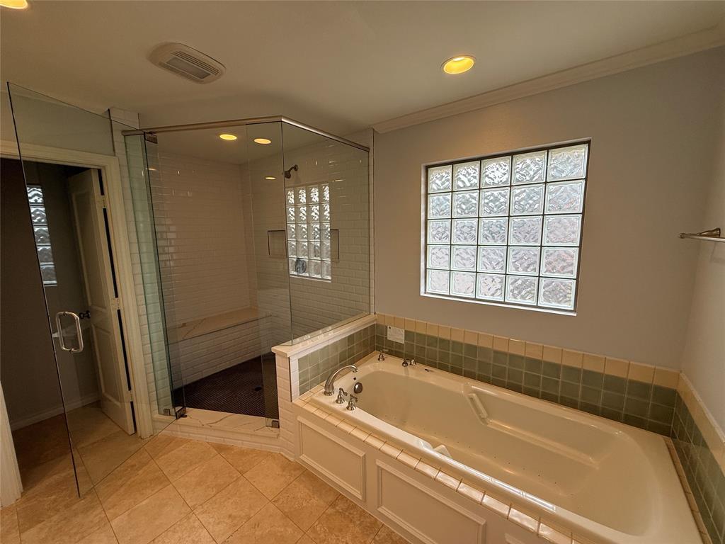 4916 Sugar Mill Road Dallas, TX 75244 - Photo 15 of 18 Full bathroom with a garden tub, a stall shower, recessed lighting, and crown molding