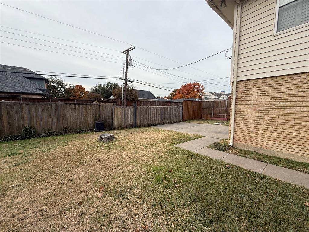 4916 Sugar Mill Road Dallas, TX 75244 - Photo 18 of 18 Fenced backyard with a patio area
