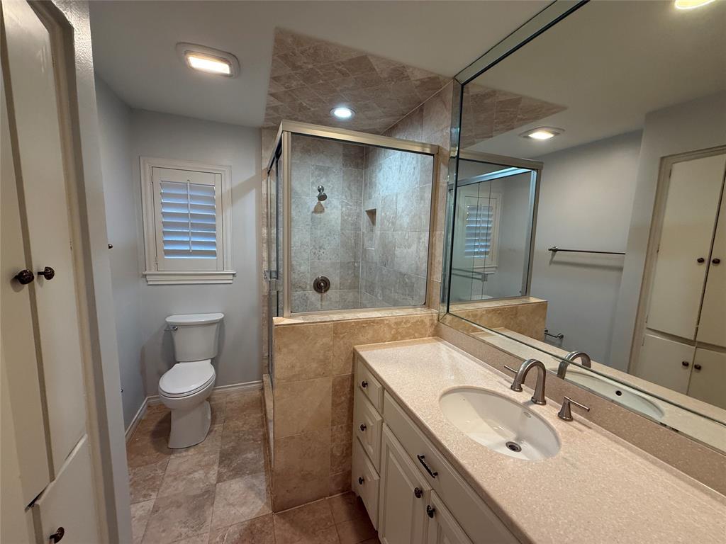 4916 Sugar Mill Road Dallas, TX 75244 - Photo 10 of 18 Full bath with a stall shower, vanity, and recessed lighting