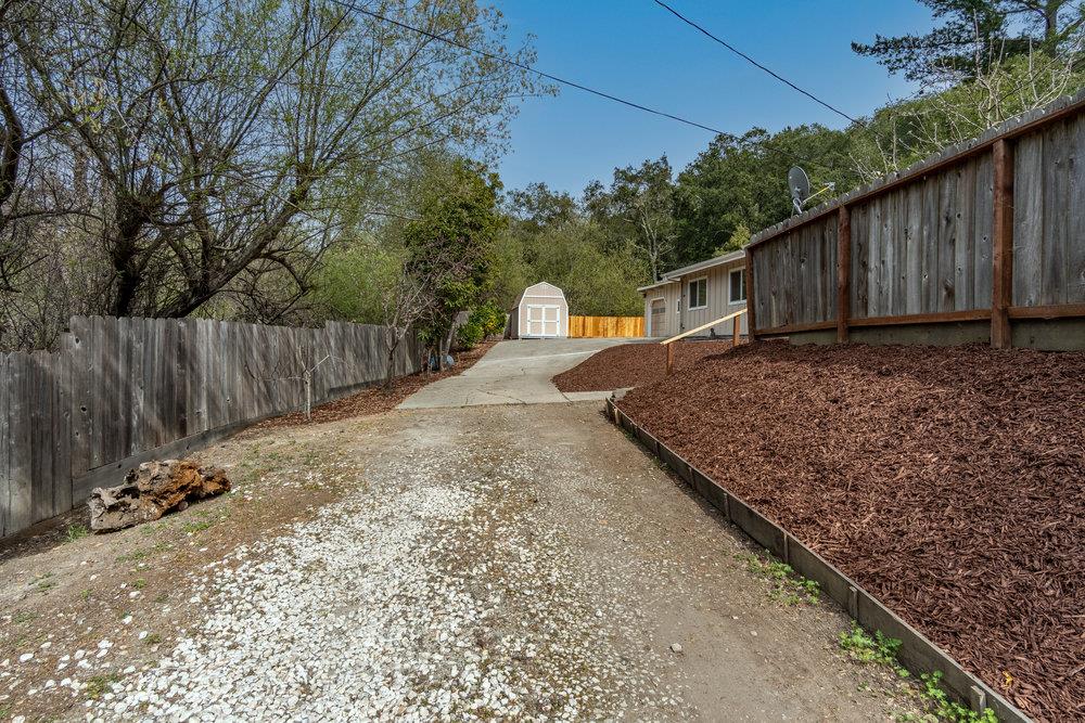 102 Smith Road Watsonville, CA 95076 - Photo 34 of 41 a view of a backyard with wooden fence