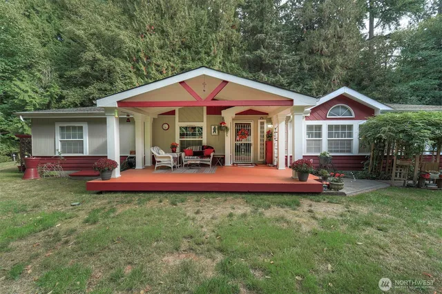 a view of a house with a yard patio and a slide