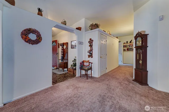 a view of a livingroom with a furniture and a ceiling fan