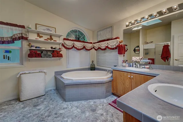 a bathroom with a sink a toilet and bathtub