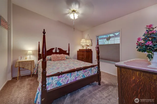 a bedroom with a bed and a dresser