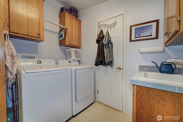 a utility room with dryer and washer