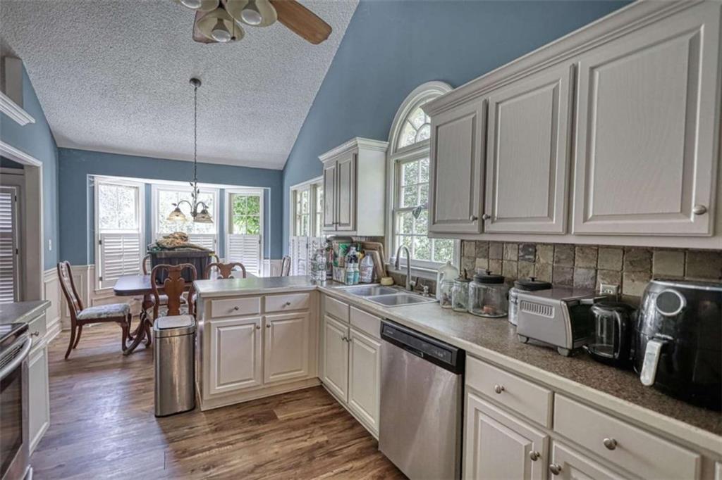3588 Old Hamilton Mill Road Northeast Buford, GA 30519 - Photo 13 of 49 a kitchen with sink cabinets and window