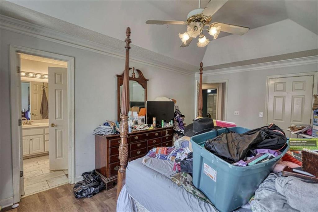 3588 Old Hamilton Mill Road Northeast Buford, GA 30519 - Photo 19 of 49 a living room with furniture and a flat screen tv