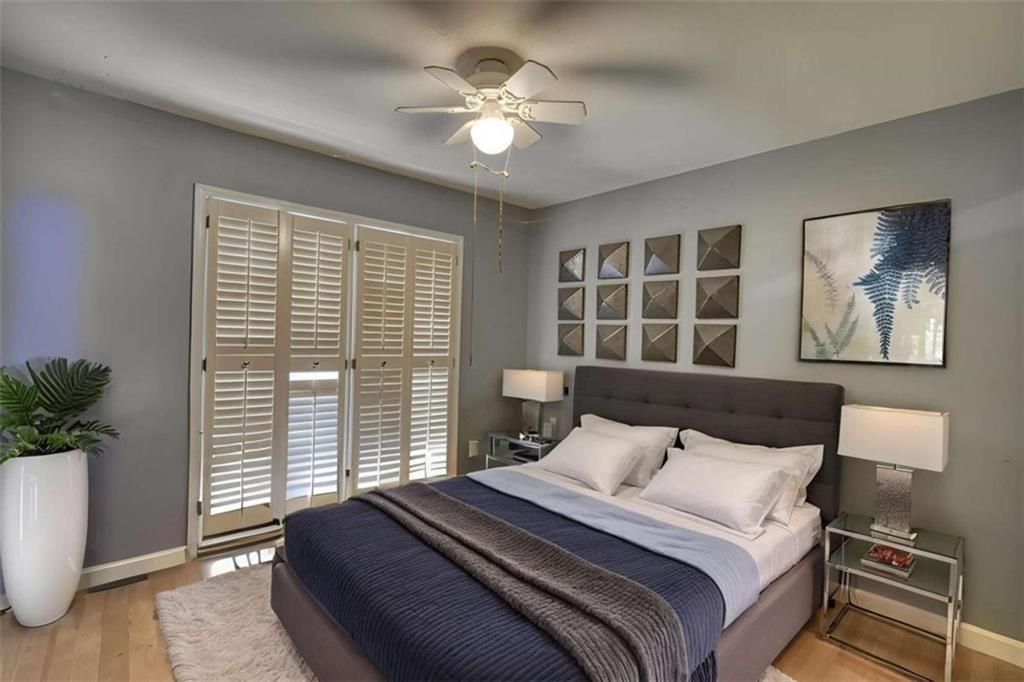 3588 Old Hamilton Mill Road Northeast Buford, GA 30519 - Photo 26 of 49 a bedroom with a large bed and a window