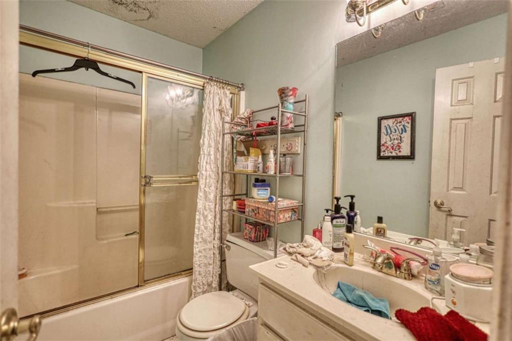 3588 Old Hamilton Mill Road Northeast Buford, GA 30519 - Photo 36 of 49 a bathroom with a granite countertop sink mirror and toilet