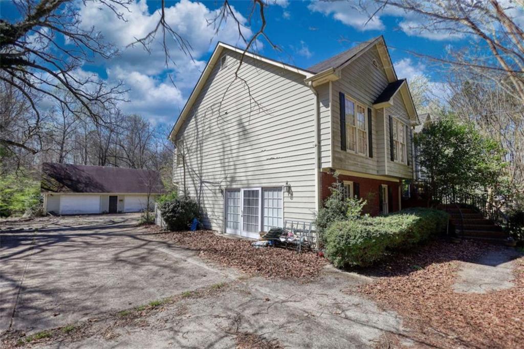 3588 Old Hamilton Mill Road Northeast Buford, GA 30519 - Photo 4 of 49 a view of a house with a yard