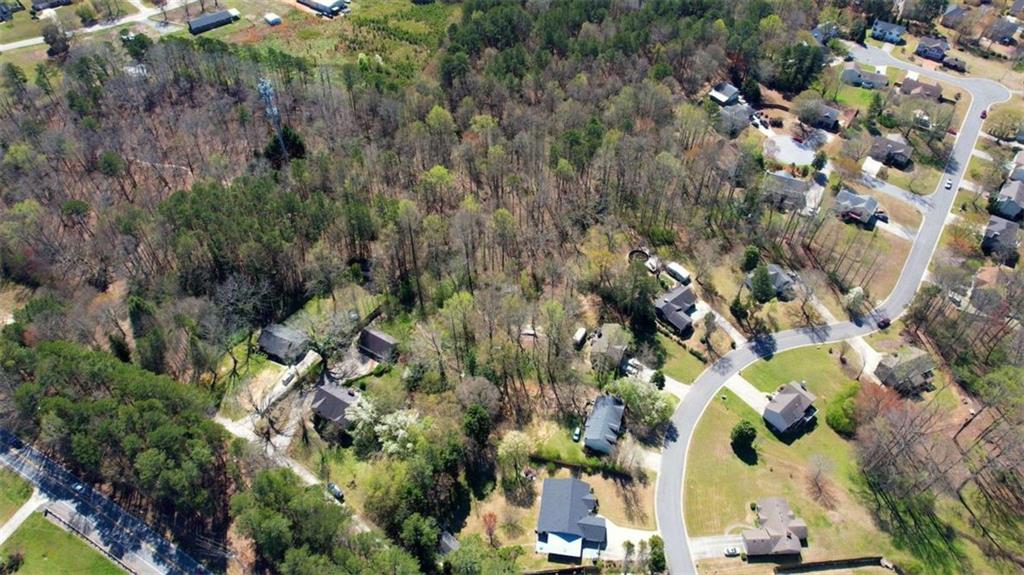 3588 Old Hamilton Mill Road Northeast Buford, GA 30519 - Photo 47 of 49 an aerial view of residential houses with outdoor space and trees