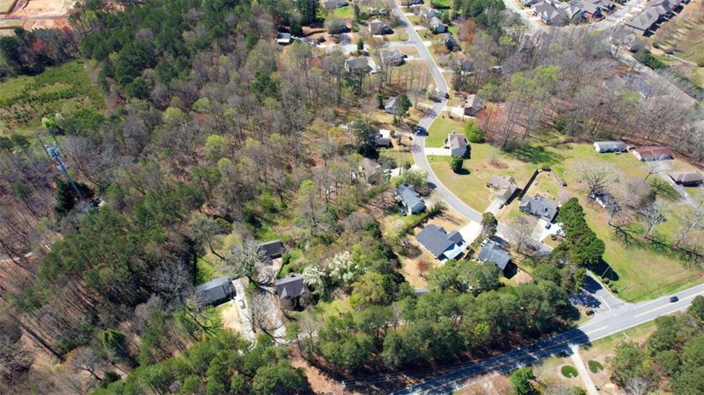 3588 Old Hamilton Mill Road Northeast Buford, GA 30519 - Photo 48 of 49 an aerial view of residential houses with outdoor space