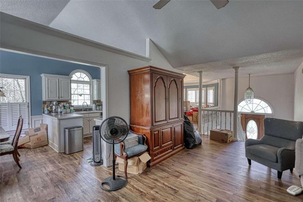 3588 Old Hamilton Mill Road Northeast Buford, GA 30519 - Photo 8 of 49 a living room with furniture a fireplace a rug and a window