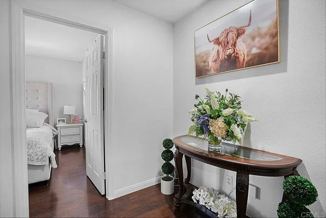 a view of a room with workspace and a potted plant
