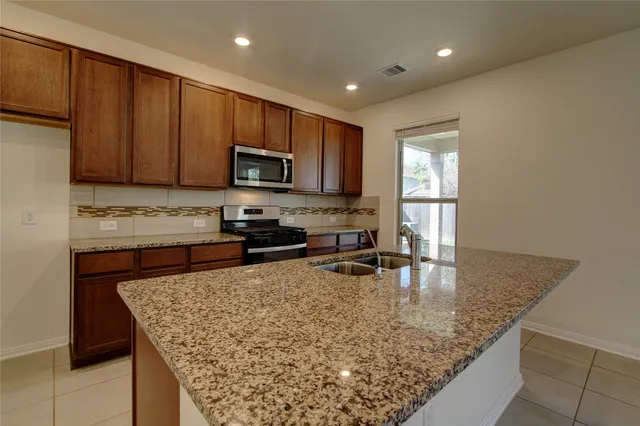 a bathroom with a sink mirror and toilet