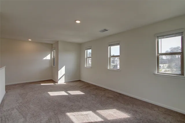 a view of a big room with windows