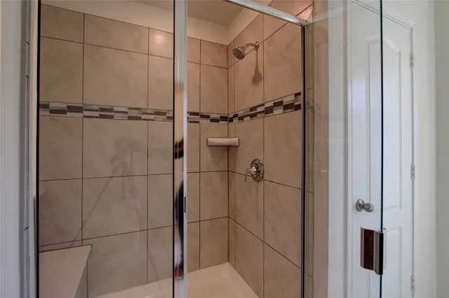 a spacious bathroom with a sink a mirror and a bathtub
