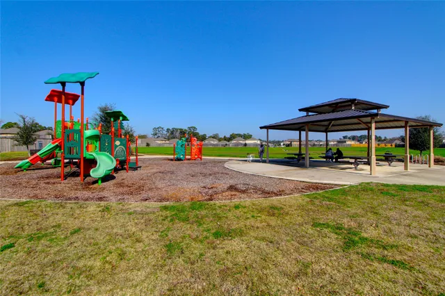 a view of swimming pool with outdoor seating