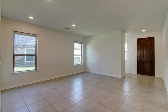 a view of an empty room with a window