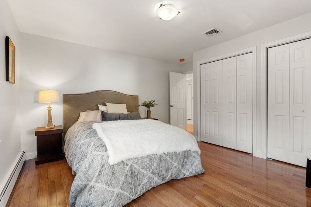 21 Albemarle Road Newton, MA 02460 - Photo 11 of 25 a bedroom with a bed and wooden floor