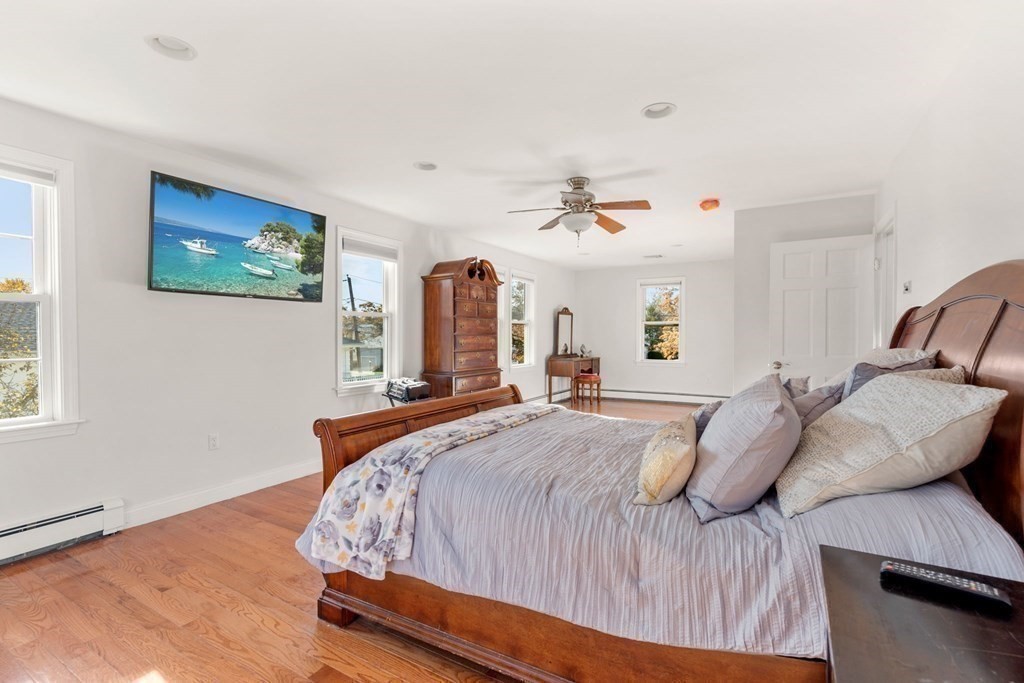 21 Albemarle Road Newton, MA 02460 - Photo 12 of 25 a bedroom with a bed and wooden floor