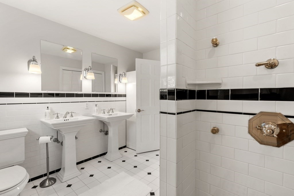 21 Albemarle Road Newton, MA 02460 - Photo 14 of 25 a bathroom with a sink a toilet and shower