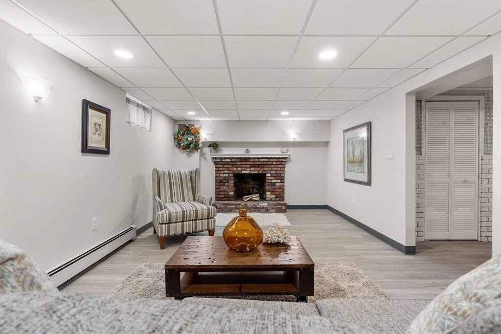 21 Albemarle Road Newton, MA 02460 - Photo 19 of 25 a living room with furniture and a fireplace