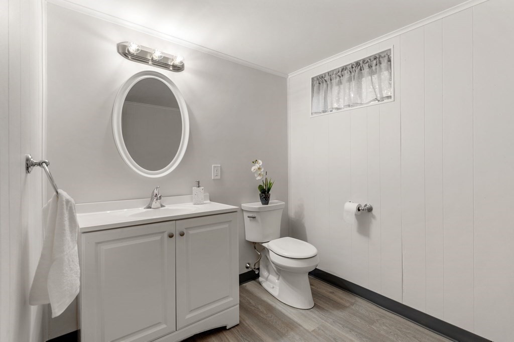 21 Albemarle Road Newton, MA 02460 - Photo 22 of 25 a bathroom with a toilet sink and mirror