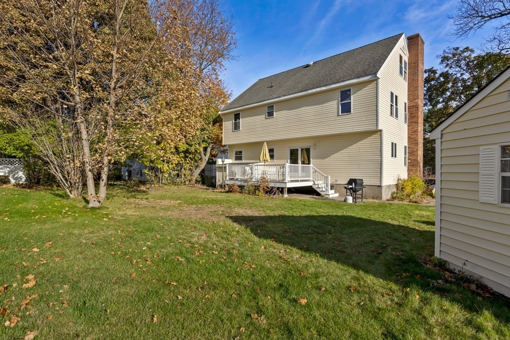 21 Albemarle Road Newton, MA 02460 - Photo 24 of 25 a view of a white house with a yard