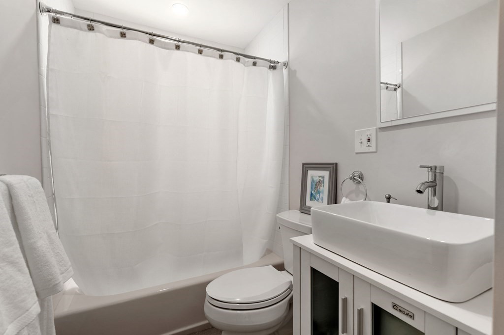 21 Albemarle Road Newton, MA 02460 - Photo 7 of 25 a bathroom with a sink toilet and shower