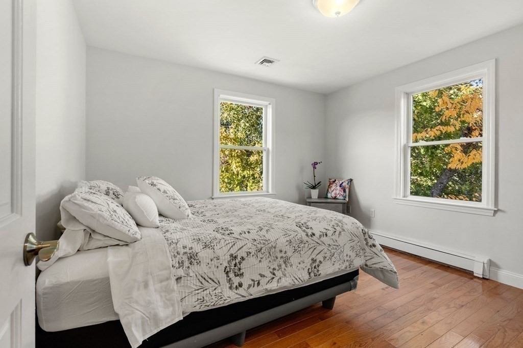 21 Albemarle Road Newton, MA 02460 - Photo 10 of 25 a bedroom with a bed and a window